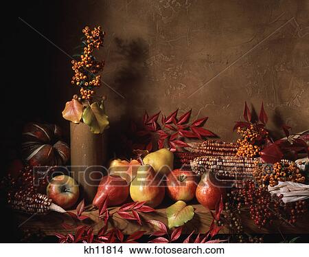 Picture - harvest still life autumn leaves fruits and vegetables. Fotosearch