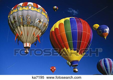 hot air balloons in a blue cloudless sky View Large Photo Image Stock Photography - hot air balloons in a blue cloudless sky. Fotosearch