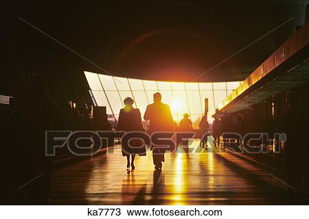 Stock Image - interior of airline terminal at sunset dulles international airport near washington, dc. Fotosearch