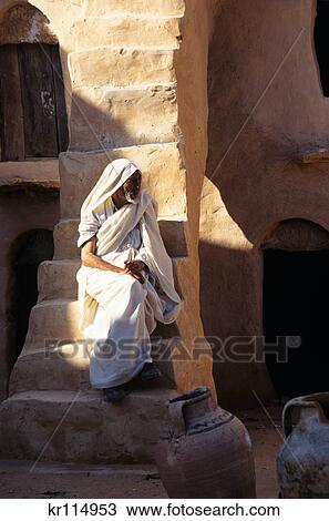 ksar ouled soltane, tunisia berber man on steps of ghorfa View Large Photo Image Stock Image - ksar ouled soltane, tunisia berber man on steps of ghorfa. Fotosearch