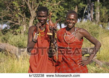 Stock Photo - masai mara, kenya, africa masai selling handicrafts. Fotosearch