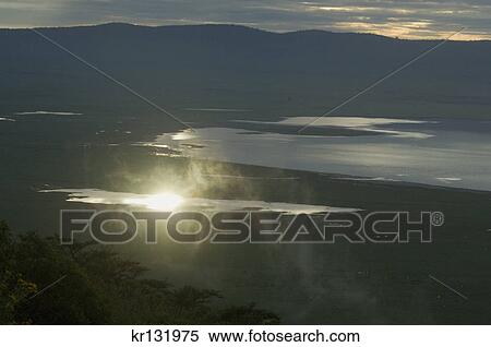 moody sunrise at ngorongoro crater tanzania africa View Large Photo Image Stock Photography - moody sunrise at ngorongoro crater tanzania africa. Fotosearch