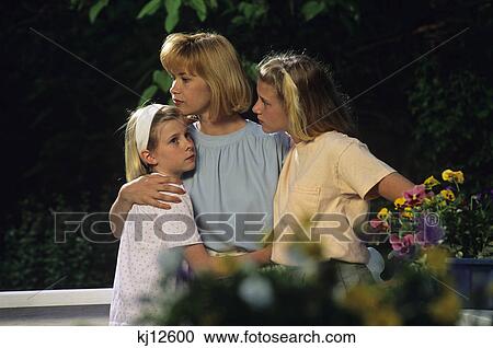 mother comforting two daughters View Large Photo Image Stock Image - mother comforting two daughters. Fotosearch