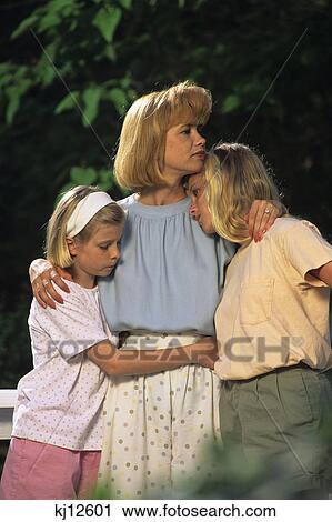 mother comforting two daughters View Large Photo Image Stock Image - mother comforting two daughters. Fotosearch