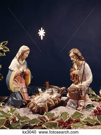 Stock Image - nativity scene with star baby jesus in manger mary joseph. Fotosearch