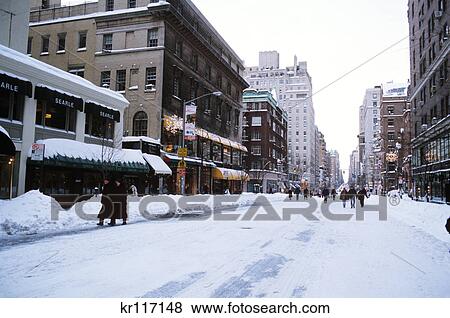 new york, ny people walking down snowy street View Large Photo Image Stock Photo - new york, ny people walking down snowy street. Fotosearch