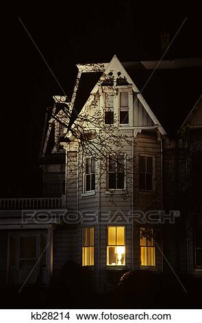 Picture - night view of a victorian house. Fotosearch
