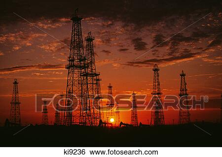 Stock Photograph - oil field at sunset. Fotosearch