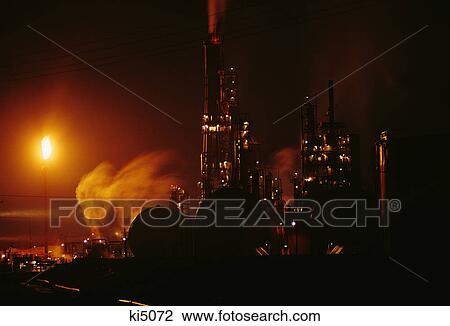 Stock Image - oil refinery at night. Fotosearch