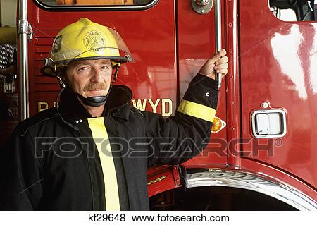 portrait of fireman in full gear by truck View Large Photo Image Stock Photo - portrait of fireman in full gear by truck. Fotosearch
