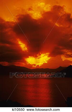 red sunrays on sky & water View Large Photo Image Stock Image - red sunrays on sky & water. Fotosearch