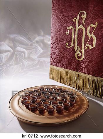 religious still life of tray of wine offerings for communion and embroidered cloth with ihs View Large Photo Image Stock Image - religious still life of tray of wine offerings for communion and embroidered cloth with ihs. Fotosearch