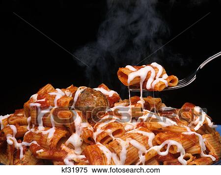 Stock Photography - rigatoni with meatballs and mozzarella. Fotosearch