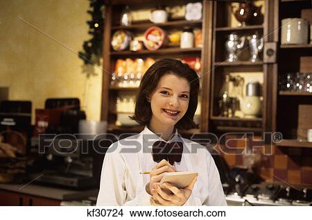 smiling young waitress ready to take order View Large Photo Image Picture - smiling young waitress ready to take order. Fotosearch