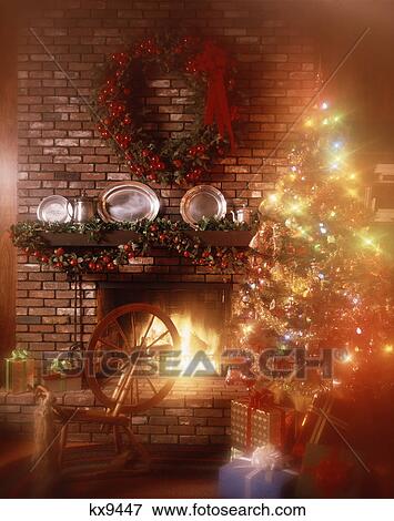 soft focus christmas tree by fireplace decorated mantel spinning wheel View Large Photo Image Stock Photo - soft focus christmas tree by fireplace decorated mantel spinning wheel. Fotosearch