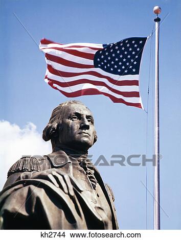Picture - statue of george washington with american flag above. Fotosearch