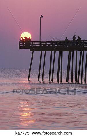 sunrise at outer banks fishing pier bodie island, north carolina outer banks, barrier island View Large Photo Image Stock Photography - sunrise at outer banks fishing pier bodie island, north carolina outer banks, barrier island. Fotosearch