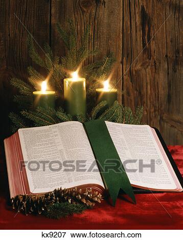 three green christmas candles pine branches open bible View Large Photo Image Stock Photo - three green christmas candles pine branches open bible. Fotosearch