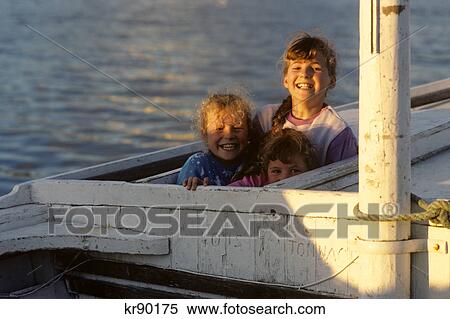 three smiling girls fishing boat county donegal ireland View Large Photo Image Stock Photography - three smiling girls fishing boat county donegal ireland. Fotosearch