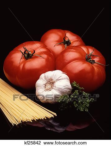 tomatoes, garlic parsley and pasta View Large Photo Image Stock Image - tomatoes, garlic parsley and pasta. Fotosearch
