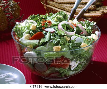 tossed lettuce salad in a clear glass bowl View Large Photo Image Stock Photograph - tossed lettuce salad in a clear glass bowl. Fotosearch