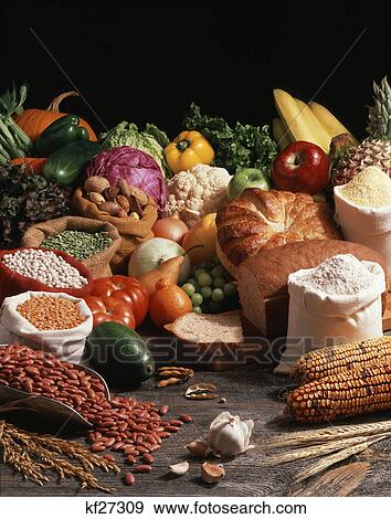 Stock Photo - vegan vegetarian strict vegetarian food groups: legumes, grains, nuts, vegetables and fruits. Fotosearch