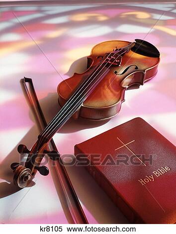 violin and bible shadow from stained glass View Large Photo Image Stock Photography - violin and bible shadow from stained glass. Fotosearch