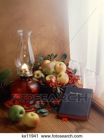 winter still life bible hurricane lamp fruit basket in curtained window View Large Photo Image Stock Image - winter still life bible hurricane lamp fruit basket in curtained window. Fotosearch