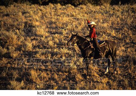woman cowgirl on horse with lasso rock springs ranch bend oregon usa View Large Photo Image Stock Photo - woman cowgirl on horse with lasso rock springs ranch bend oregon usa. Fotosearch