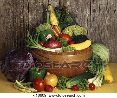 Stock Photo - wooden bowl full of fresh garden vegetables. Fotosearch