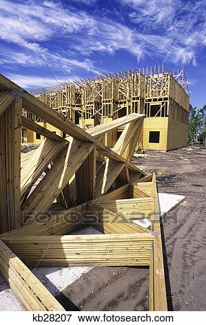 Stock Photo - wooden frames on construction site of townhouses. Fotosearch