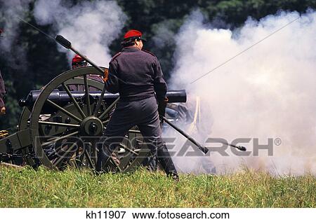 Stock Photo - 1860S Confederate Cannon Firing Reenactment Gettysburg Battle American Civil War Pennsylvania Usa. Fotosearch