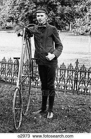 1880S 1890S Man Called Wheelman Wearing Clothing For Bicycle Riding Standing Next To High Wheel Ratchet Drive Bicycle View Large Photo Image Stock Image - 1880S 1890S Man Called Wheelman Wearing Clothing For Bicycle Riding Standing Next To High Wheel Ratchet Drive Bicycle. Fotosearch