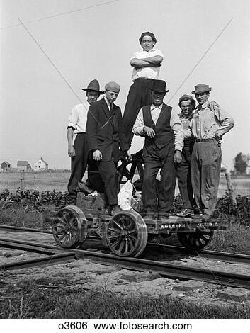 Stock Photograph - 1890S 1900S Portrait Group Of Men Railroad Workers Standing On Handcar Outdoor. Fotosearch