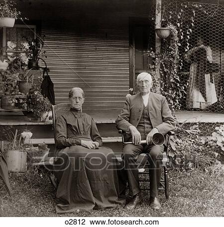 1890S 1900S Portrait Senior Couple Seated In Garden Man Holding Ear Trumpet View Large Photo Image Stock Image - 1890S 1900S Portrait Senior Couple Seated In Garden Man Holding Ear Trumpet. Fotosearch