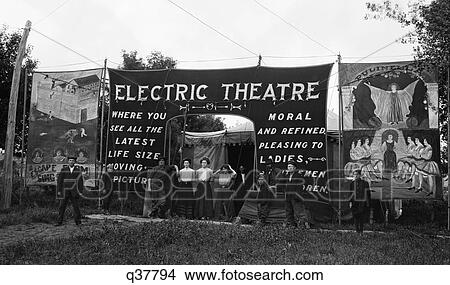 1900S 1910S Group People Standing At Entrance Outdoor Traveling Moving Picture Theater View Large Photo Image Picture - 1900S 1910S Group People Standing At Entrance Outdoor Traveling Moving Picture Theater. Fotosearch