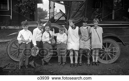 1910S Children Lined Up In Front Of Truck Facing Camera View Large Photo Image Stock Photo - 1910S Children Lined Up In Front Of Truck Facing Camera . Fotosearch