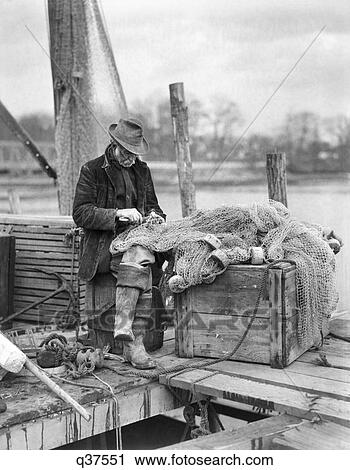 1910S Old Man Fisherman Repairing Fish Nets On The Dock Westport Connecticut View Large Photo Image Stock Image - 1910S Old Man Fisherman Repairing Fish Nets On The Dock Westport Connecticut. Fotosearch