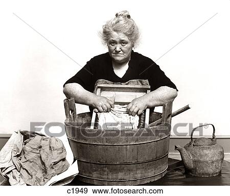 1920S 1930S 1940S Senior Woman Washing Clothes In Old Fashioned Wooden Tub And Washboard View Large Photo Image Stock Photo - 1920S 1930S 1940S Senior Woman Washing Clothes In Old Fashioned Wooden Tub And Washboard. Fotosearch