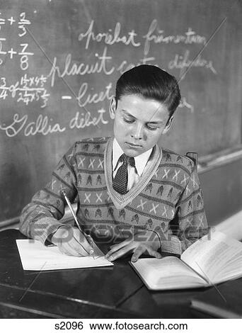 1920S 1930S Boy Vee Neck Sweater Writing At School Desk View Large Photo Image Stock Photograph - 1920S 1930S Boy Vee Neck Sweater Writing At School Desk . Fotosearch