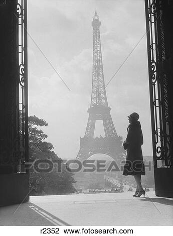 1920S 1930S Moody Silhouetted Woman Paris Standing In Trocadero Looking Toward Eiffel Tower View Large Photo Image Stock Image - 1920S 1930S Moody Silhouetted Woman Paris Standing In Trocadero Looking Toward Eiffel Tower . Fotosearch