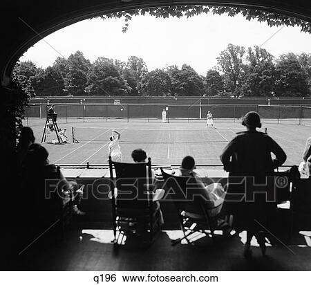 1920S 1930S Silhouetted Spectators Watching Tennis Match At Country Club View Large Photo Image Stock Photograph - 1920S 1930S Silhouetted Spectators Watching Tennis Match At Country Club. Fotosearch