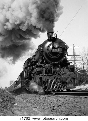 1920S 1930S Steam Engine Pulling Passenger Train Smoke Billowing From Exhaust Stack View Large Photo Image Stock Image - 1920S 1930S Steam Engine Pulling Passenger Train Smoke Billowing From Exhaust Stack. Fotosearch