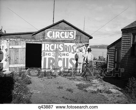 1920S Bill Posters Sticking Signs On The Side Of A Barn Advertising A Traveling Circus View Large Photo Image Stock Photo - 1920S Bill Posters Sticking Signs On The Side Of A Barn Advertising A Traveling Circus. Fotosearch