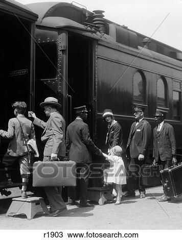 1920S Family Mother Father Son Daughter Boarding Passenger Train Assisted By Trainman And Porters Carrying Luggage Outdoor View Large Photo Image Stock Image - 1920S Family Mother Father Son Daughter Boarding Passenger Train Assisted By Trainman And Porters Carrying Luggage Outdoor. Fotosearch