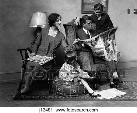 1920S Family Of Four Mother Father Son Daughter In Living Room Reading Newspaper Together Indoor View Large Photo Image Stock Image - 1920S Family Of Four Mother Father Son Daughter In Living Room Reading Newspaper Together Indoor. Fotosearch