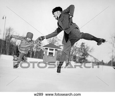 1920S Man Father And Little Girl Daughter Ice Skating Outdoors In Winter View Large Photo Image Stock Photo - 1920S Man Father And Little Girl Daughter Ice Skating Outdoors In Winter. Fotosearch
