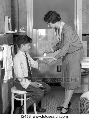1920S Mother In Bathroom Bandaging Son'S Hand View Large Photo Image Stock Image - 1920S Mother In Bathroom Bandaging Son'S Hand. Fotosearch