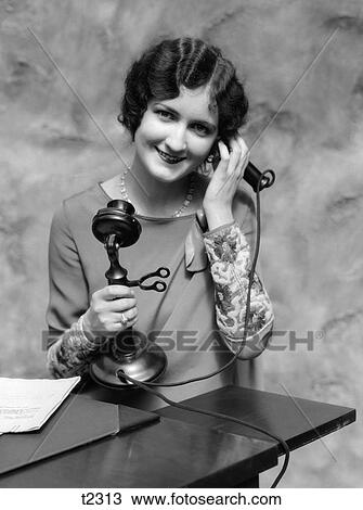1920S Portrait Of Woman On Candlestick Telephone Smiling Looking At Camera View Large Photo Image Stock Image - 1920S Portrait Of Woman On Candlestick Telephone Smiling Looking At Camera. Fotosearch