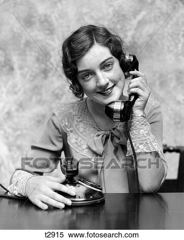 1920S Portrait Pretty Woman Smiling Talking On Fancy Telephone Wearing Lace Collar Cuffs Indoor Looking At Camera View Large Photo Image Stock Photography - 1920S Portrait Pretty Woman Smiling Talking On Fancy Telephone Wearing Lace Collar Cuffs Indoor Looking At Camera. Fotosearch